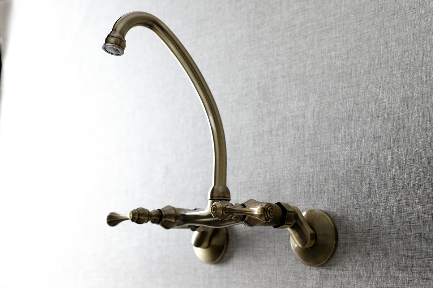 Elements of Design ES3143L Adjustable Center Wall Mount Kitchen Faucet, Antique Brass